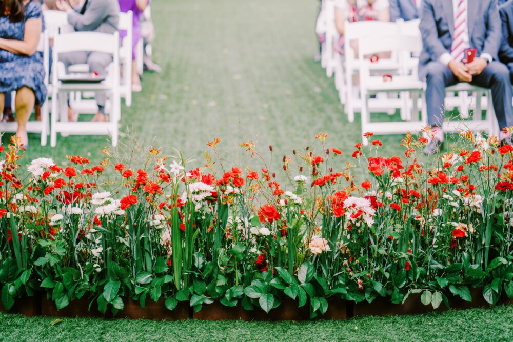 red and white and blush ceremony flowers