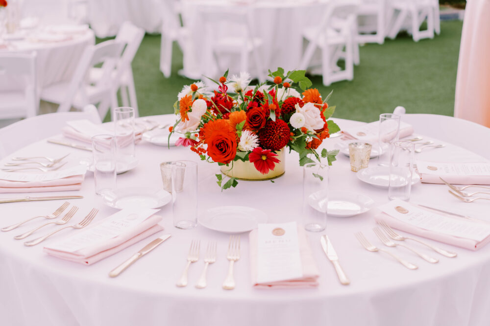 low gold centerpieces filled with wedding flowers