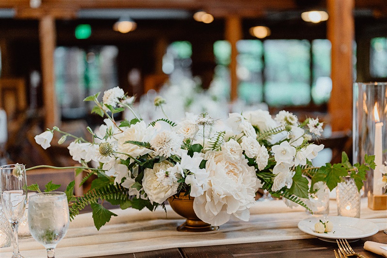 Long guest table centerpieces made form white flowers
