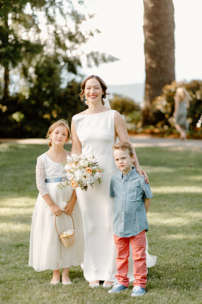 Bride and flower girl holding basket