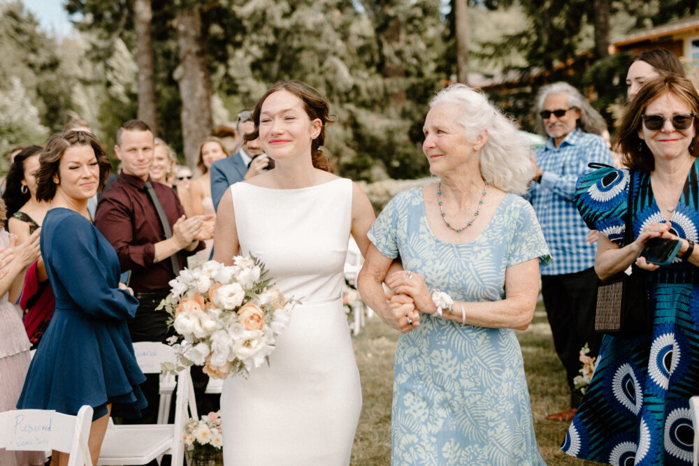 Mon walks bride down the aisle at this Alderbrook Lodge wedding
