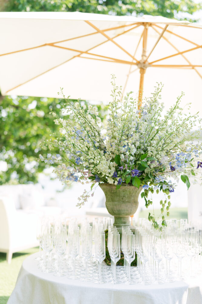 wedding welcome table, champagne welcome, Terra cotta urn with white and blue flowers