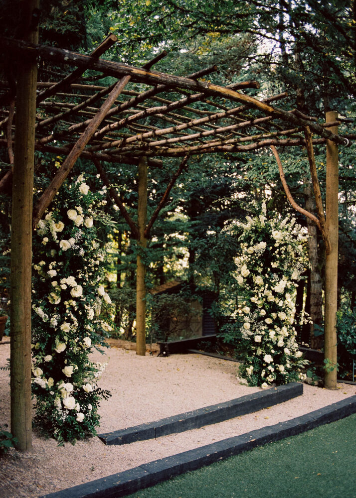 Ceremony flowers. Tall flower pillars made with white flowers