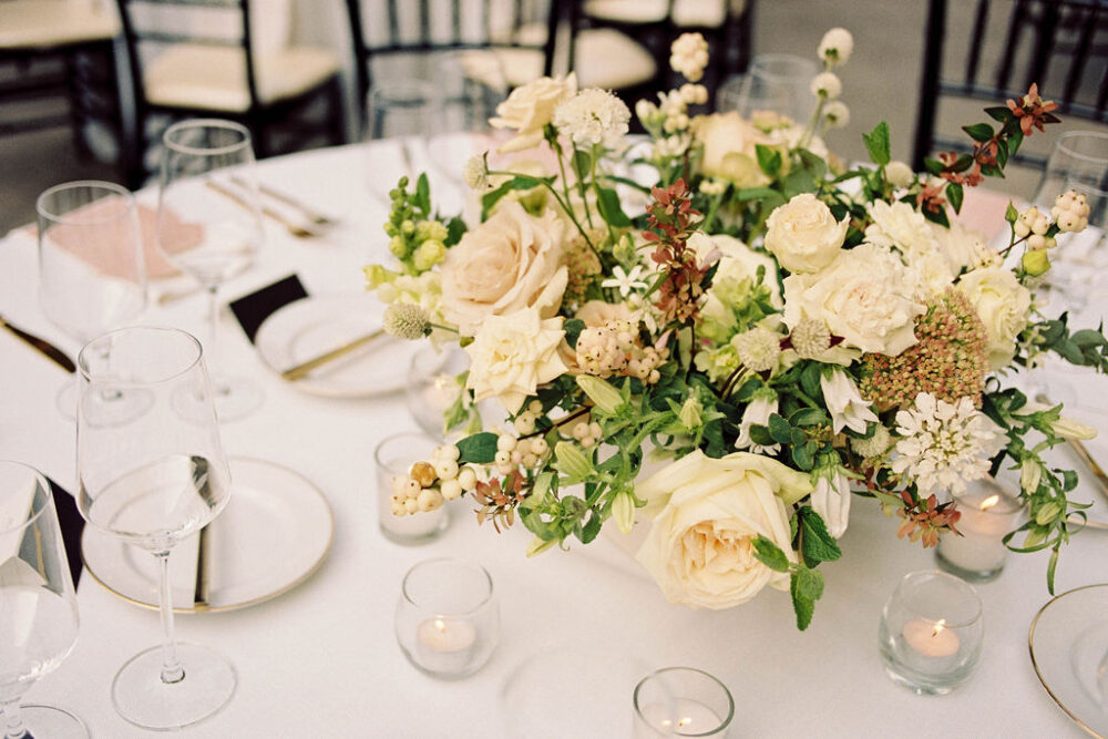 wedding centerpiece made with white and blush flowers