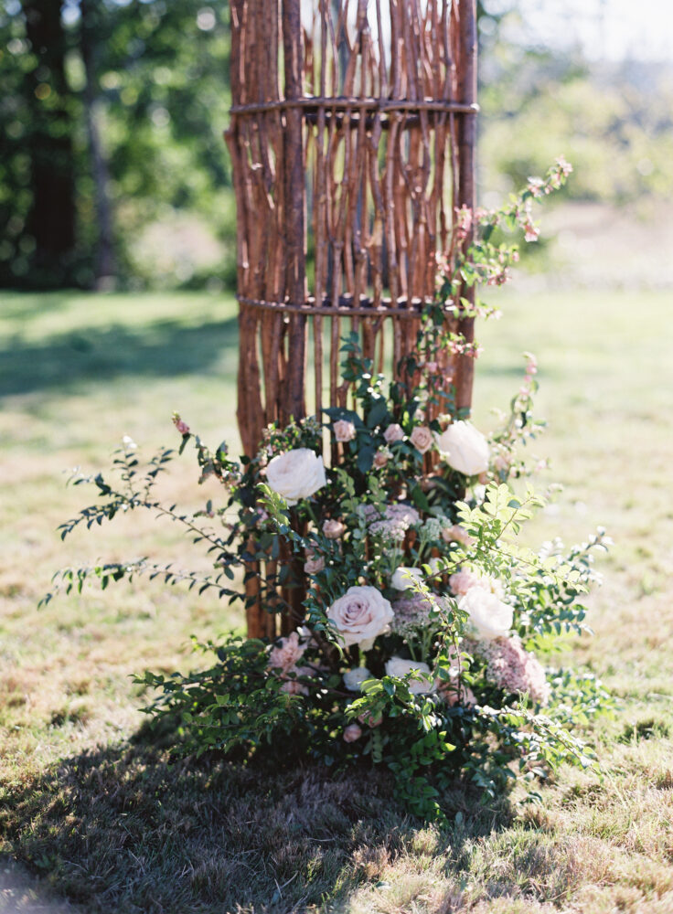 wedding arbor details. Blush and green flowers and foliage